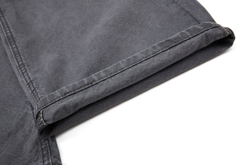 Close-up of charcoal denim folded hem