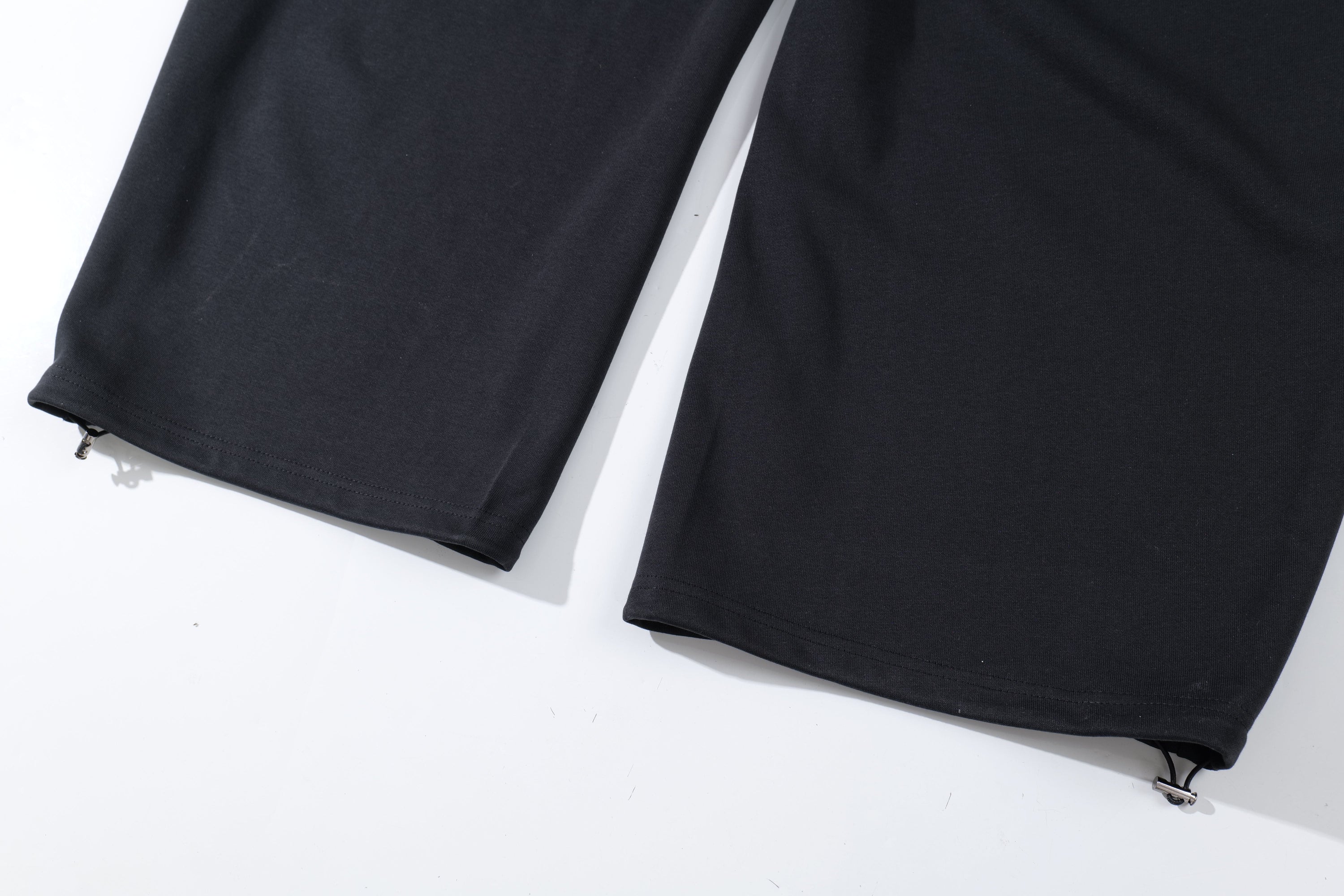 Omirad Plaid-Waist Barrel Track Pants | Bold Script Print