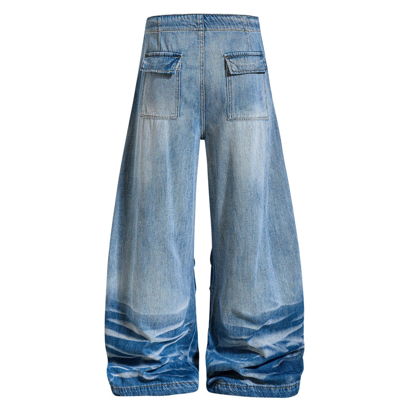 Back view of vintage wash super baggy jeans with oversized rear patch pockets and wide legs
