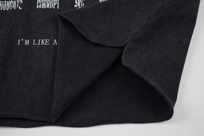 Black distressed sleeveless gothic punk T-shirt with raw hem, layered cutout details, and printed text on the front