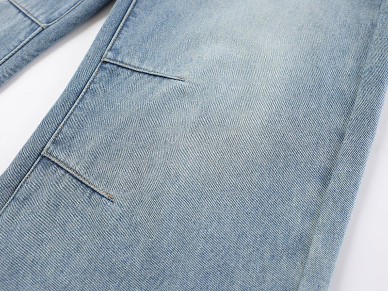 Close-up of the leg and stitched seam on light blue denim pants