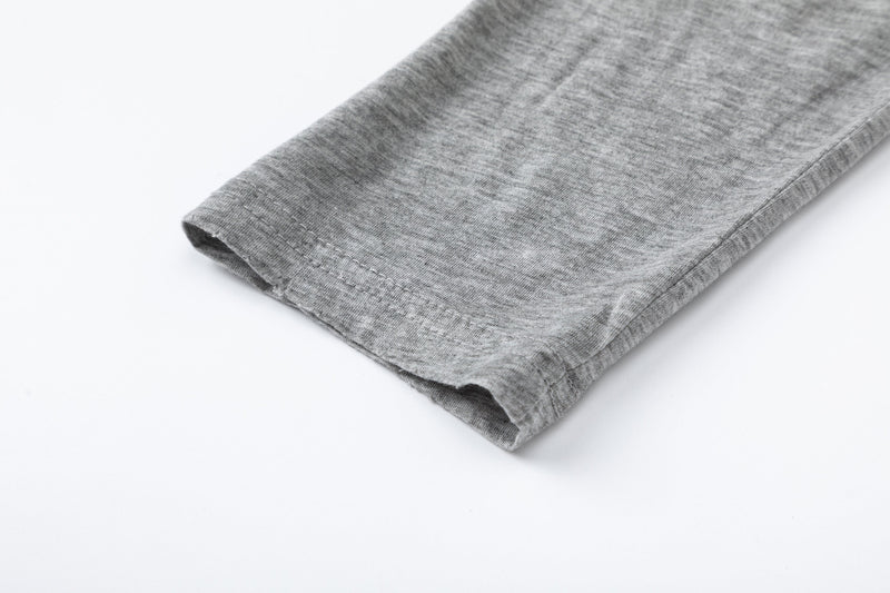 Close-up of gray sleeve hem with stitched cuff edge