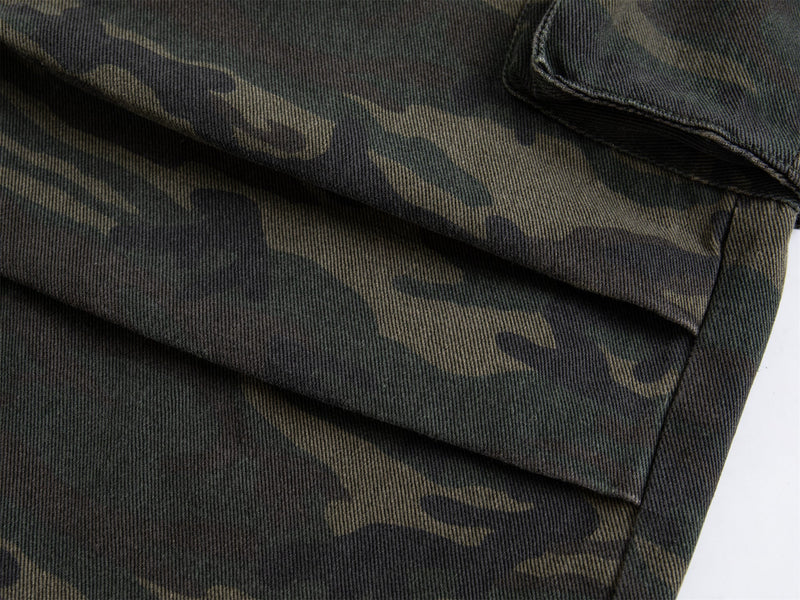 Close-up of wide-leg hem on dark camo cargo pants