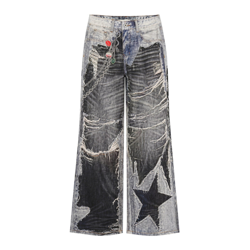 Front view of distressed patchwork wide-leg jeans with dark wash panels and chain detail