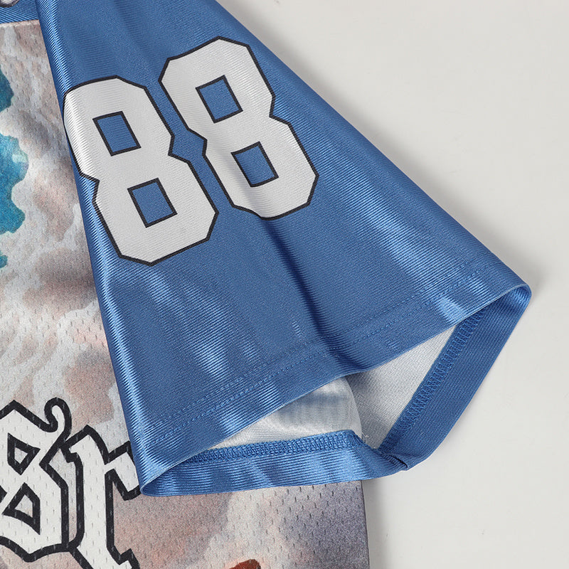 Blue football jersey sleeve with white number 88 and graphic print, featuring a stitched hem and sporty fabric texture