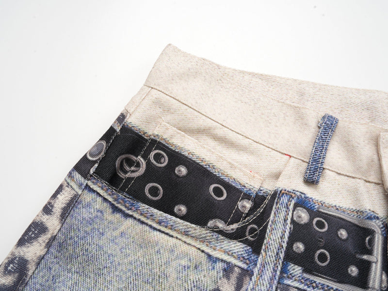 Close-up of the waistband seam and black belt panel with circular print and visible stitching