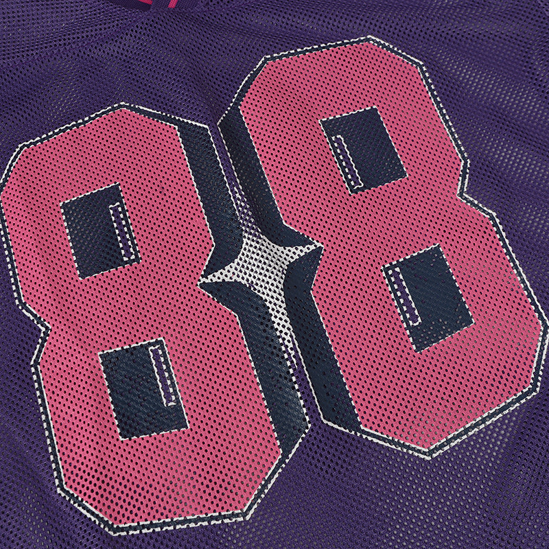 Close-up of a purple mesh varsity jersey with large pink number 88 and navy outlined lettering