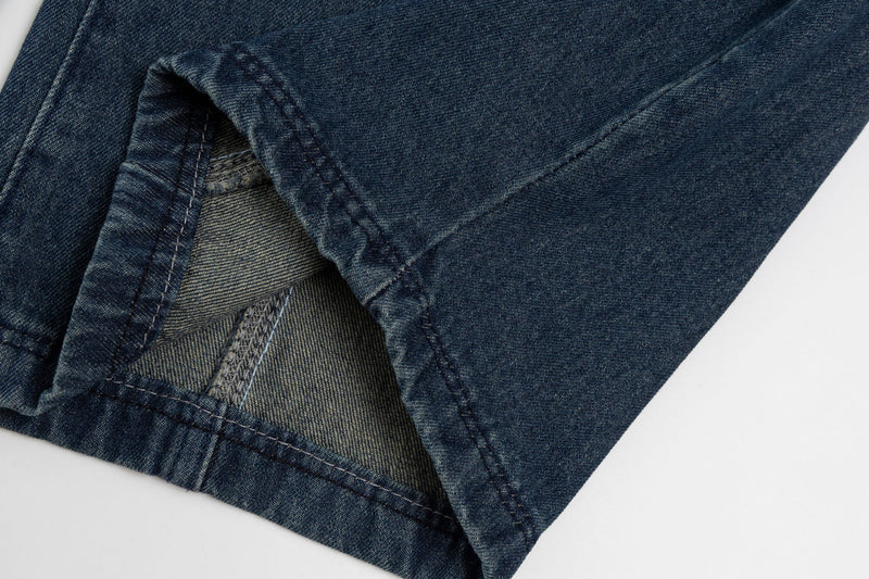 Close-up of jean hem showing inner seam and cuff detail