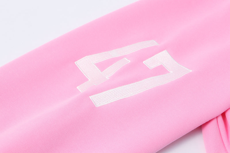 White 47 graphic printed on pastel pink hoodie sleeve close-up