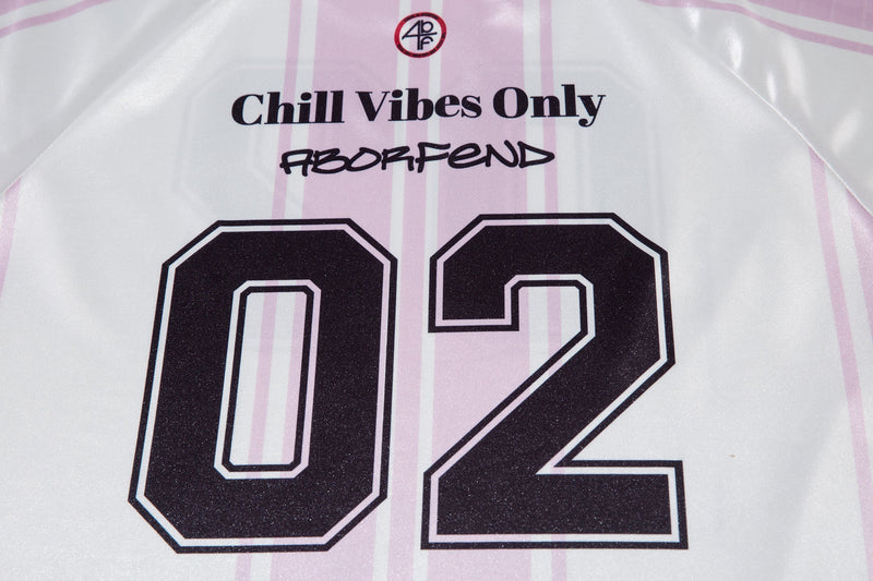 Close-up of white jersey front showing Chill Vibes Only text above the 02 graphic