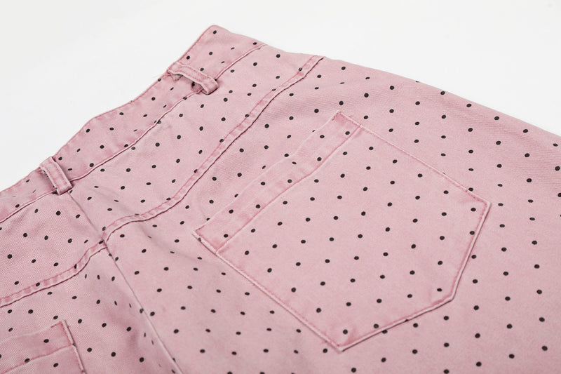 Close-up of pink polka dot pants showing back pocket and waistband detail