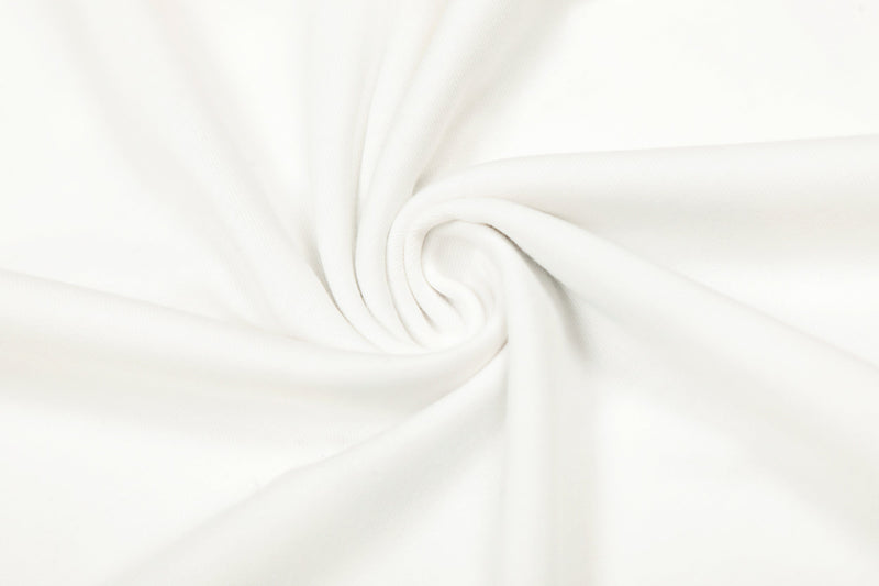 Close-up of white fabric gathered into a spiral fold with smooth texture
