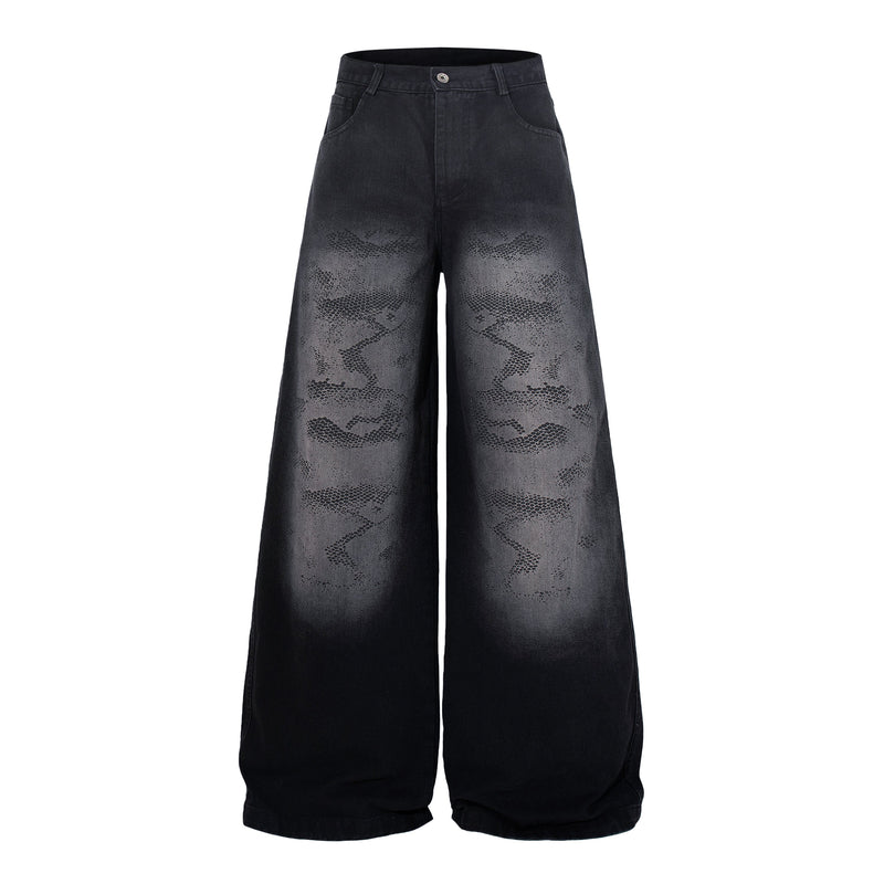 Front view of dark wide-leg jeans with gray camo-style wash