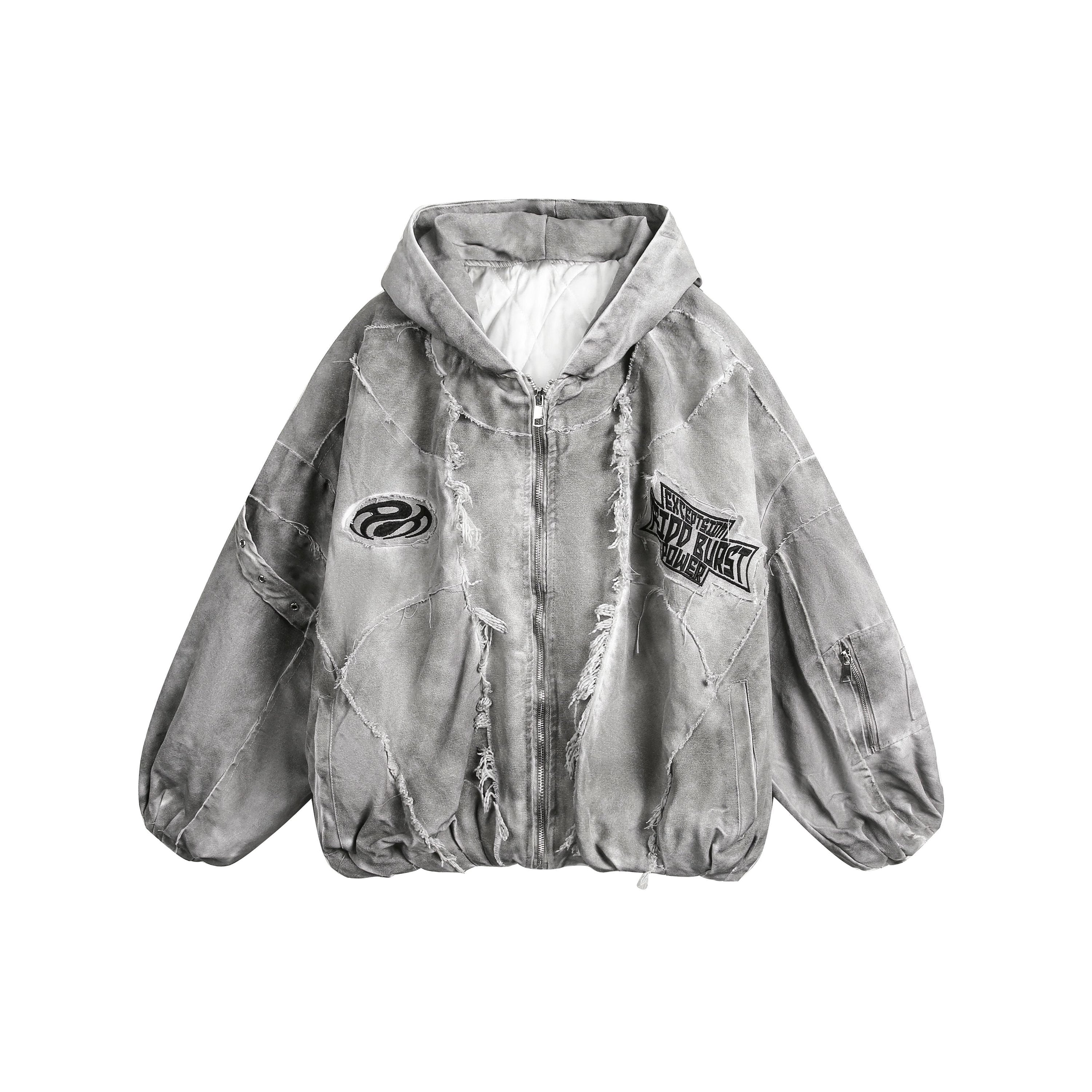 Front view of a grey distressed patchwork hoodie jacket with frayed seams, graphic patches, and zip closure