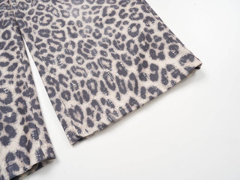 Close-up of flared leopard print pant hem with straight stitched edge
