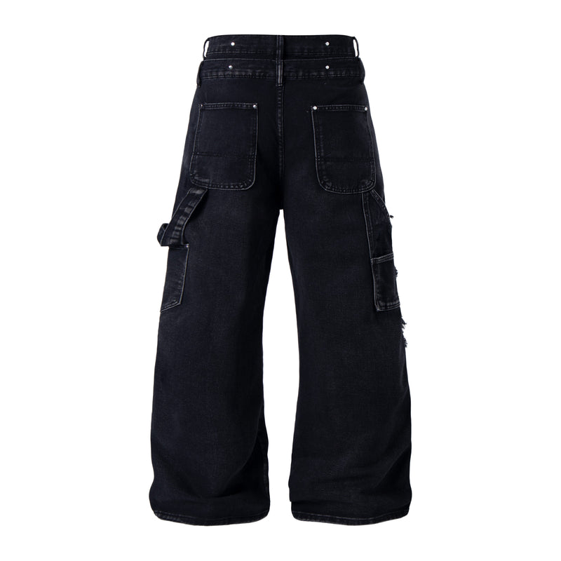 Back view of black distressed denim pants with patch pockets and cargo pocket