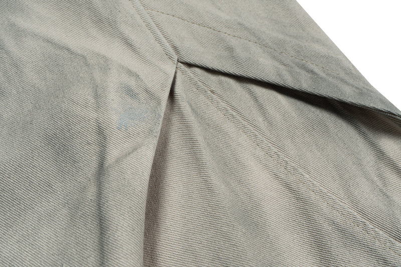 Close-up of back yoke seam and waistband on washed grey pants