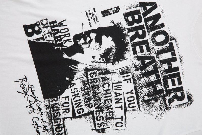 Angled front view of white long sleeve tee with black streetwear collage print