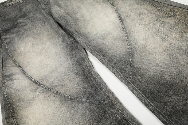 Close-up of barrel-leg seams and faded wash on the legs