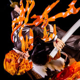 The Rengoku Kyojuro Demon Slayer Figure - Flame Hashira, features the iconic character with flame-like orange details and a sword, set against a black background. His red hair contrasts vividly with his black and white outfit in this high-quality PVC figure by Demon Slayer.