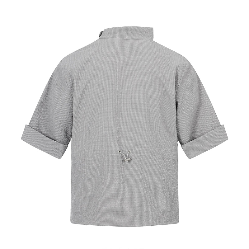Light gray short-sleeve shirt with stand collar, rolled cuffs, and asymmetric back tie detail on a textured fabric