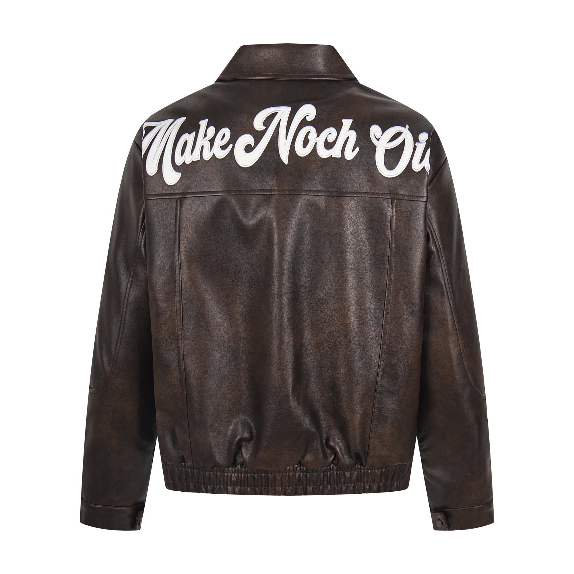 Back view of dark brown faux leather bomber jacket with oversized white script lettering across the shoulders