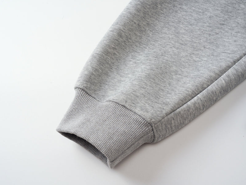 Close-up of gray hoodie sleeve cuff and ribbed knit trim