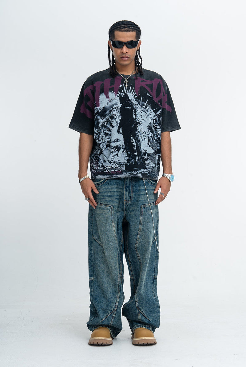 Oversized black goth graphic tee with purple print, worn with baggy distressed jeans and sunglasses