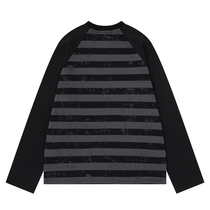 Back view of black raglan long sleeve tee with gray striped body and black sleeves