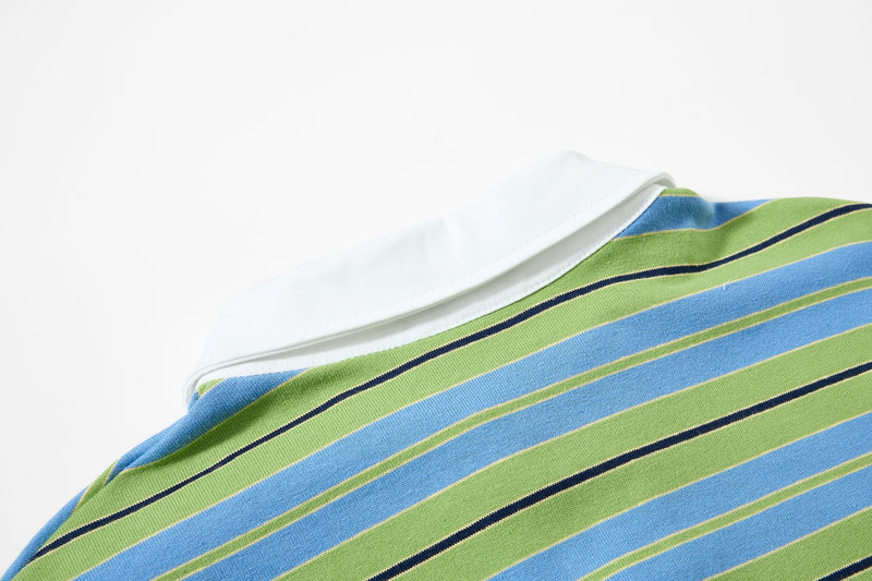 Close-up of white collar and shoulder on striped polo shirt