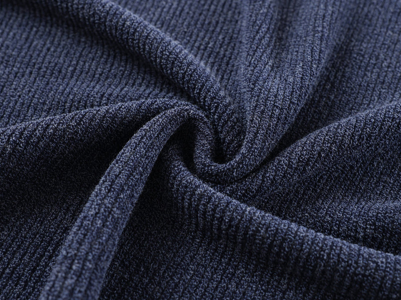 Close-up of gathered navy ribbed knit fabric texture