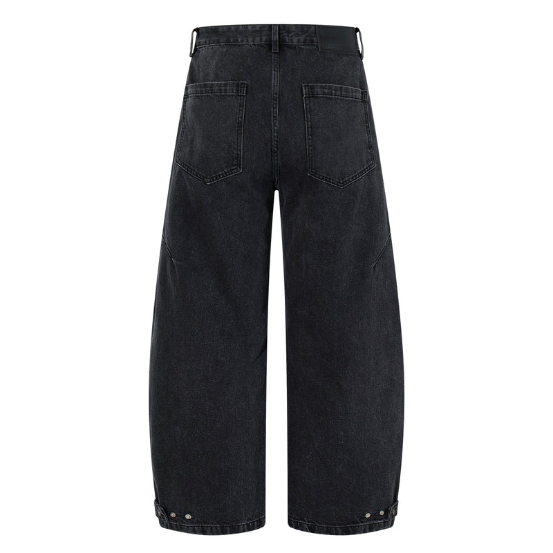 Back view of washed charcoal wide-leg denim pants with patch pockets and cuffed hems