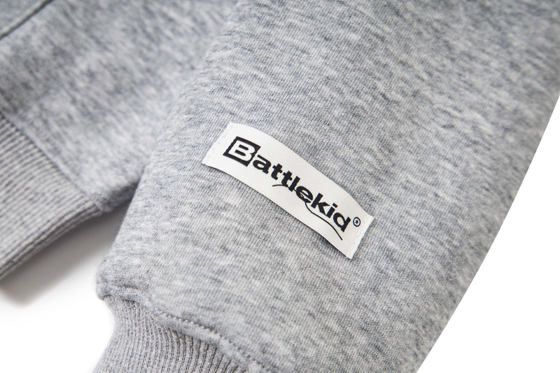 Close-up of Battelkid side label on light gray hoodie sleeve