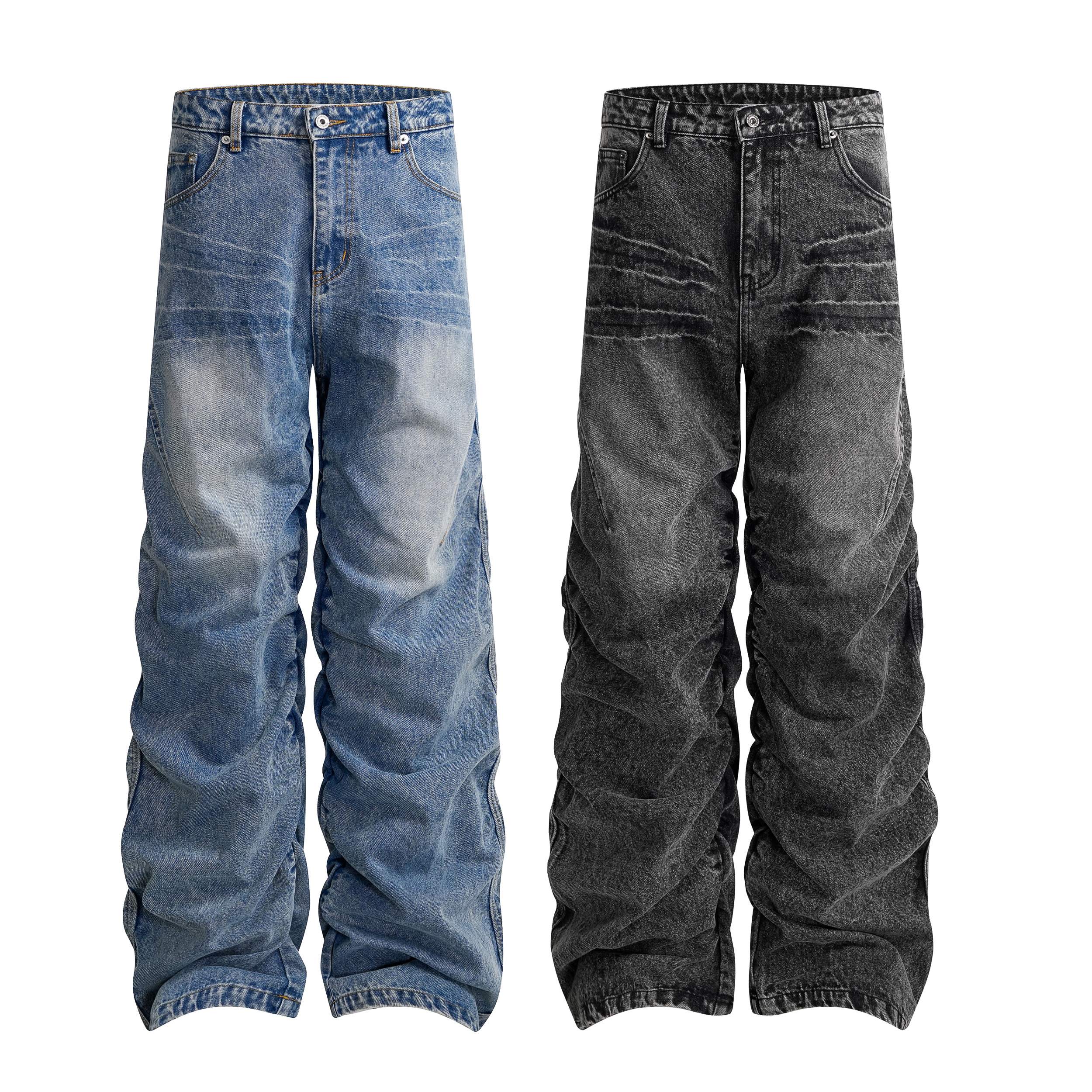 Front view of washed blue and washed black stacked wide leg denim jeans with natural hem stacking and vintage finish
