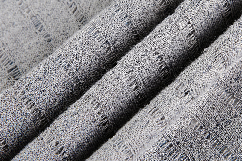 Close-up of gray sheer mesh fabric with ribbed texture and open stripes