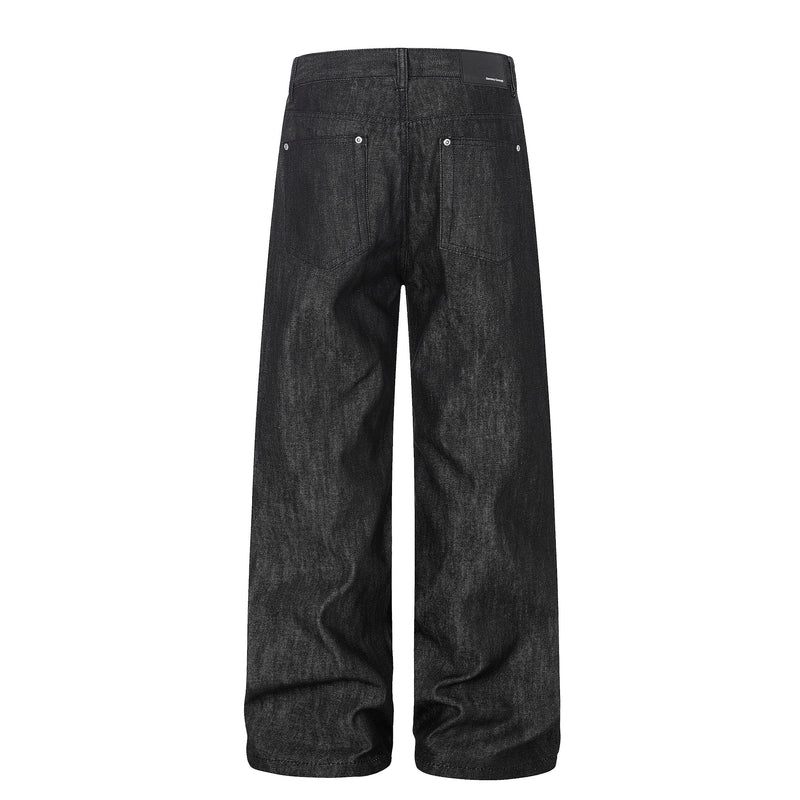 Back view of black wide leg jeans with patch pockets and brand label at waistband