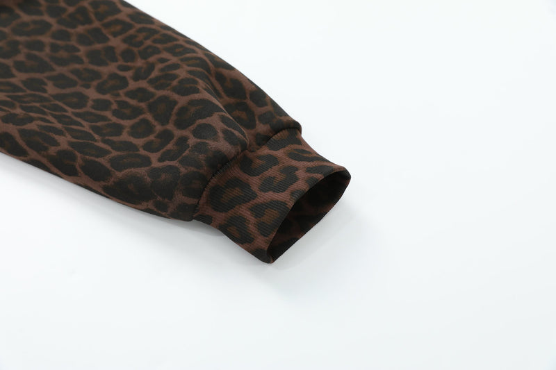 Cuffed sleeve close-up of brown leopard print hoodie