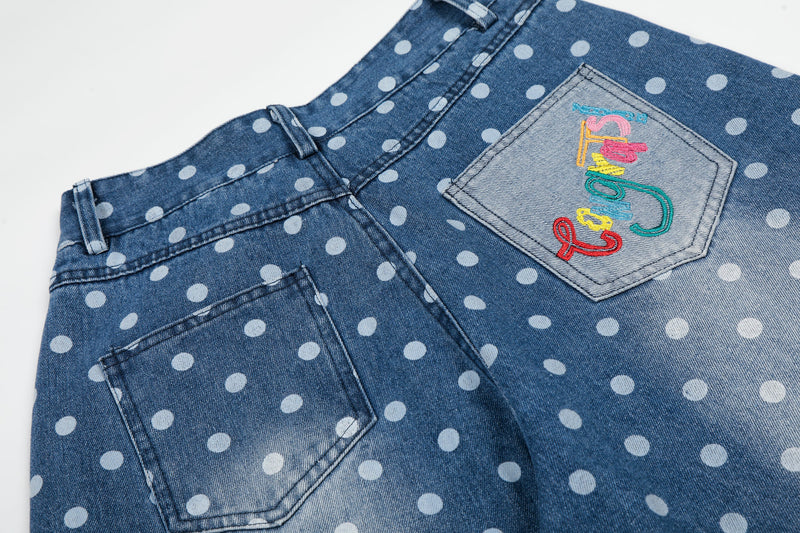 Close-up of back pockets on blue polka dot wide-leg denim jeans