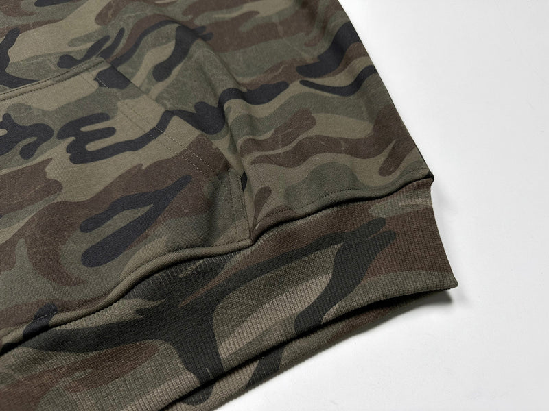 Close-up of camo hoodie kangaroo pocket and cuff seam