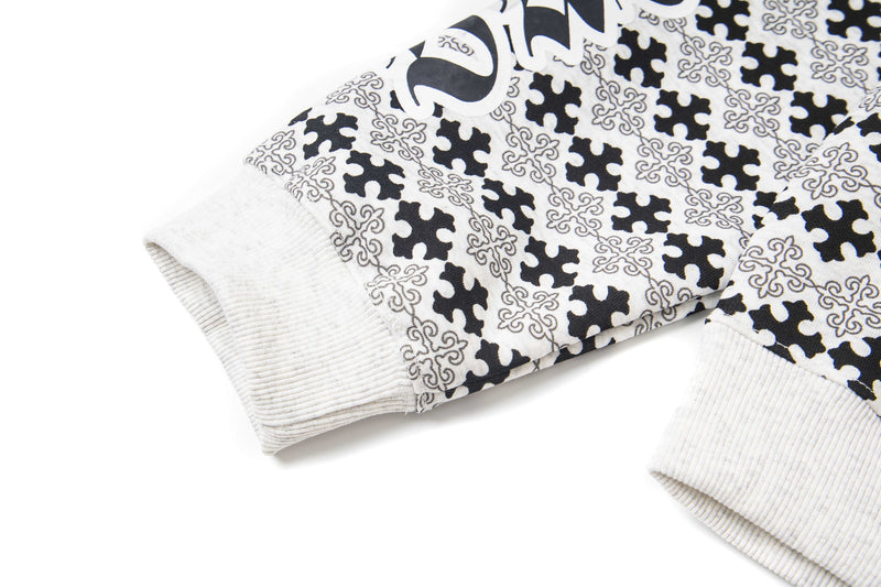 Sleeve cuff close-up on black and white patterned hoodie