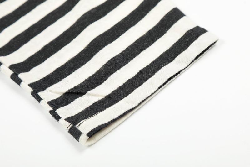 Cream and black striped sleeve cuff close-up on raglan long sleeve tee