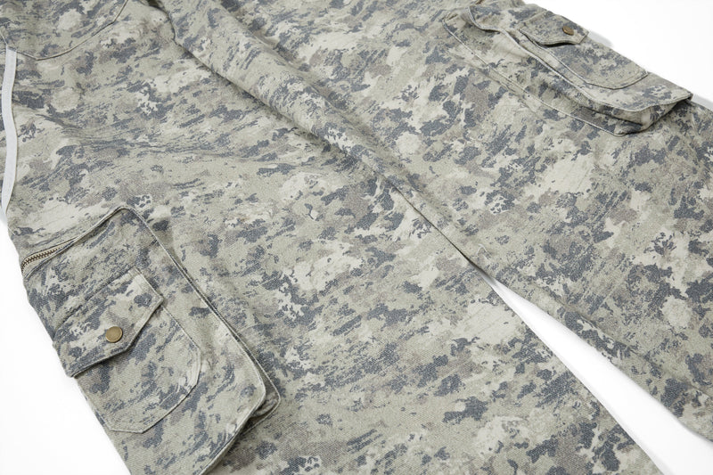 Close-up of lower leg on camo cargo pants with flap pocket and zipper detail