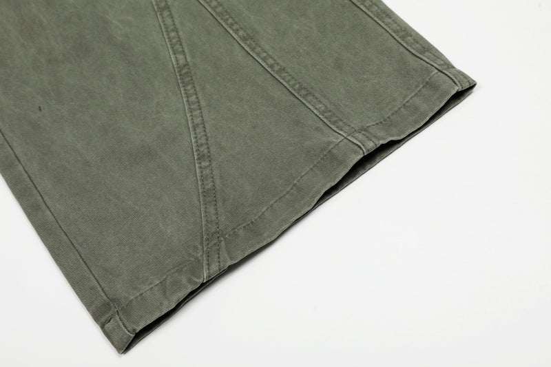 Close-up of olive green pants hem with stitched cuff edge
