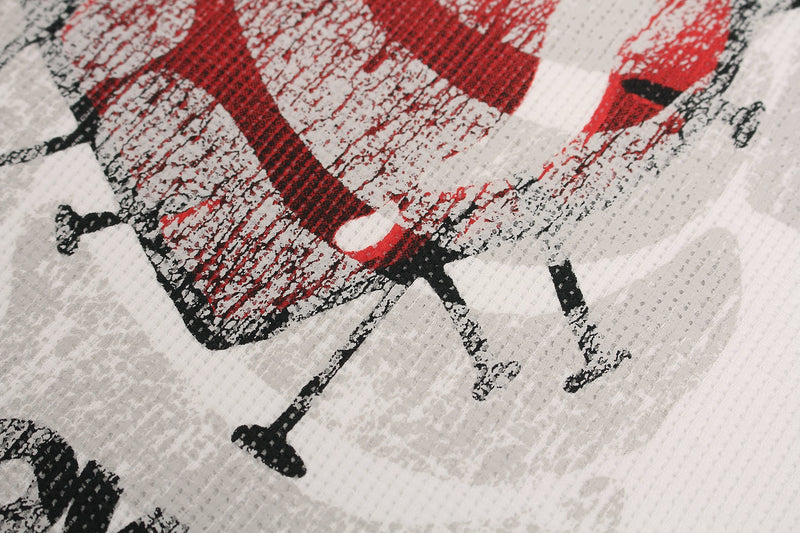 Close-up of distressed red heart graphic on white streetwear tee with cracked black and red print details