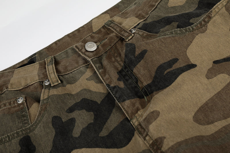 Close-up of camouflage jean waistband with button, belt loop, and topstitching