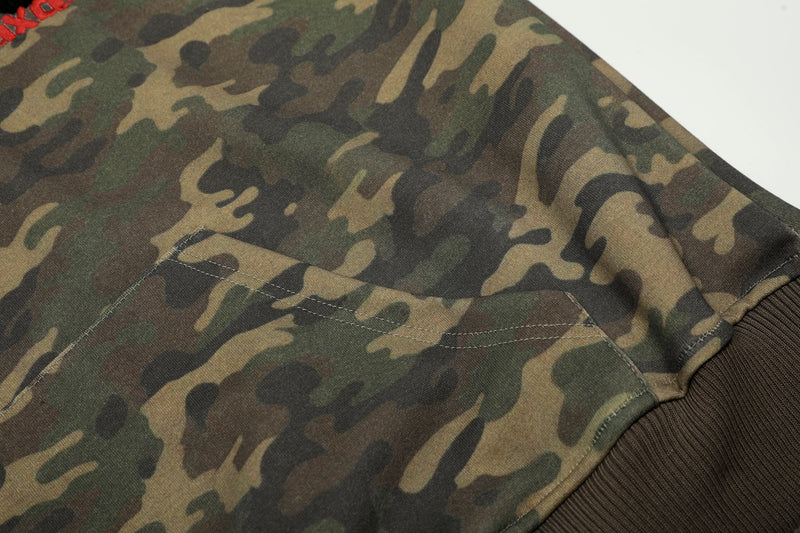 Camo hoodie sleeve with kangaroo pocket seam and ribbed cuff detail