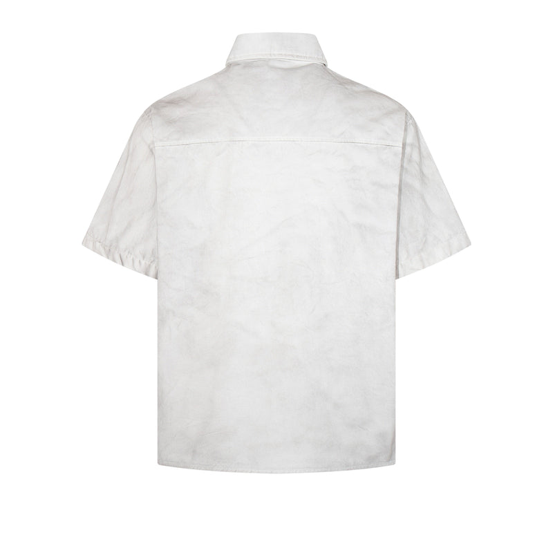 White short sleeve shirt with a clean back view, subtle distressed finish, and structured collar