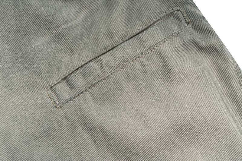 Close-up of back welt pocket on washed grey utility pants