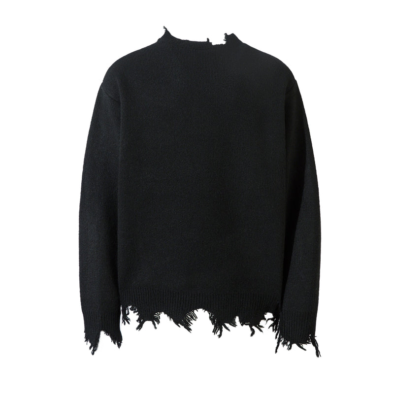 Black knit sweater front with distressed hem and frayed neckline