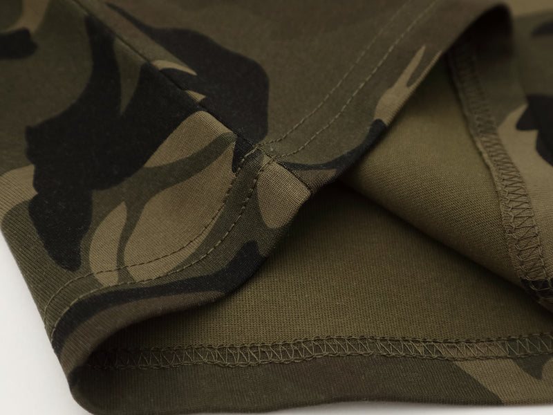 Close-up of hem seam and layered sleeve join on olive camo long sleeve tee